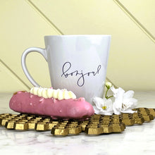 Load image into Gallery viewer, This white latte mug comes with two lavender coloured graphics printed on it, with "bonjour" one one side and the Effiel Tower surrounded by a wreath of flowers on the other: L'Abeille Française