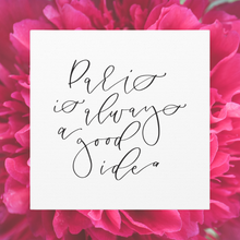 Load image into Gallery viewer, A 10" x 10" square white canvas with the phrase 'Paris is always a good idea' printed on it in a contemporary caligraphic script: L'Abeille Française