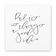 Load image into Gallery viewer, A 10" x 10" square white canvas with the phrase 'Paris is always a good idea' printed on it in a contemporary caligraphic script: L'Abeille Française