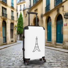 Load image into Gallery viewer, Hard-shell carry-on suitcase with black Eiffel Tower graphic on white background is accented by black trim, back, wheels and telescoping handle: Boutique L'Abeille Française