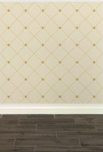 Load image into Gallery viewer, Stylized gold-coloured bees intersecting diagnonal lines on a cream-coloured wallpaper: L'Abeille Française