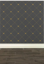 Load image into Gallery viewer, Stylized gold-coloured bees intersecting diagnonal lines on a dark grey wallpaper: L'Abeille Française