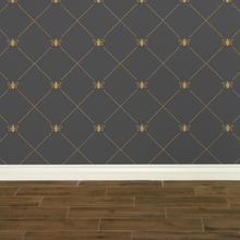 Load image into Gallery viewer, Stylized gold-coloured bees intersecting diagnonal lines on a dark grey wallpaper: L'Abeille Française
