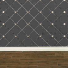 Load image into Gallery viewer, Stylized cream-coloured bees intersecting diagnonal lines on a dark grey wallpaper: L'Abeille Française