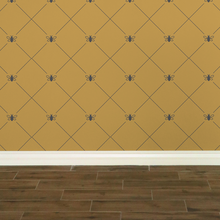 Load image into Gallery viewer, Dark grey bees intersecting diagnonal lines on a gold-coloured wallpaper: L'Abeille Française