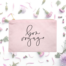Load image into Gallery viewer, Powder-pink cotton canvas cosmetic bag with 'bon voyage' printed on the front in black script: L'Abeille Française