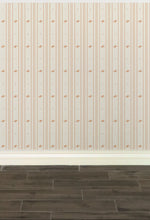 Load image into Gallery viewer, Cream-coloured wallpaper with alternating vertical stripes of peach coloured stylized flower petals and narrow lines: Boutique L'Abeille Française