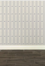 Load image into Gallery viewer, Cream-coloured wallpaper with alternating vertical stripes of lavender blue coloured stylized flower petals and narrow lines: Boutique L'Abeille Française