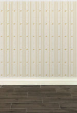 Load image into Gallery viewer, Cream-coloured wallpaper with alternating vertical stripes of gold-coloured stylized flower petals and narrow lines: Boutique L'Abeille Française