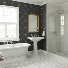 Load image into Gallery viewer, Modern bathroom with white fixtures and a shower area with a dark grey wallpaper with stylized cream-coloured bees intersecting diagnonal lines: L'Abeille Française.