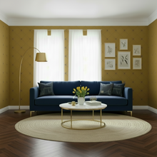 Load image into Gallery viewer, Modern living room with a blue sofa, round coffee table, and a gold-coloured wallpaper with a design of dark grey bees intersecting diagnonal lines: L'Abeille Française