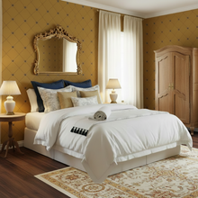 Load image into Gallery viewer, Bedroom with decorative pillows, lamps, and and a gold-coloured wallpaper with a bee and trellis design in dark grey: L'Abeille Française