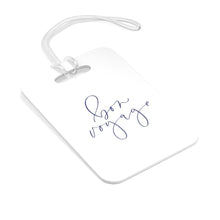Load image into Gallery viewer, Hard, white plastic luggage tag with Bon Voyage written on it in a lavender blue script