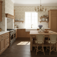 Load image into Gallery viewer, Modern kitchen with wooden cabinets, marble countertops, and a dining area and cream coloured wallpaper with green Eiffel Tower graphic: L'Abeille Française.