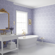 Load image into Gallery viewer, Bathroom with wallpaper with a dark lavender Eiffel Tower design on a lavender background, white bathtub, and gold accents