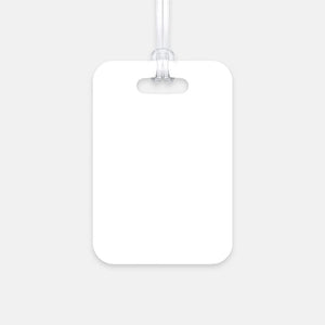 The blank back of a hard, white plastic luggage tag provides ample space for adding personal information