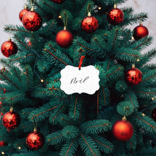 Load image into Gallery viewer, Decorated Christmas tree with red ornaments and a white &#39;Noel&#39; ornament.