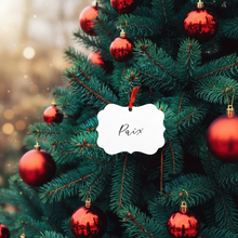 Load image into Gallery viewer, Decorated Christmas tree with red ornaments and a white ornament with &#39;Paix&#39; text.
