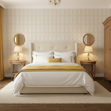Load image into Gallery viewer, Bedroom with cream-coloured wallpaper with alternating vertical stripes of gold-coloured stylized flower petals and narrow lines: Boutique L'Abeille Française