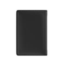 Load image into Gallery viewer, The black back cover of a faux leather passport cover.
