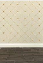 Load image into Gallery viewer, Stylized gold-coloured bees intersecting diagnonal lines on a cream-coloured wallpaper: L&#39;Abeille Française