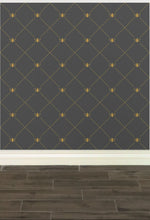 Load image into Gallery viewer, Stylized gold-coloured bees intersecting diagnonal lines on a dark grey wallpaper: L&#39;Abeille Française