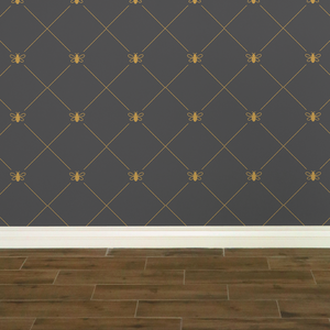 Stylized gold-coloured bees intersecting diagnonal lines on a dark grey wallpaper: L'Abeille Française