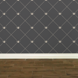 Stylized cream-coloured bees intersecting diagnonal lines on a dark grey wallpaper: L'Abeille Française