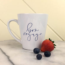 Load image into Gallery viewer, Bon Voyage Eiffel Latte Mug: bon voyage in lavender script on a white latte mug