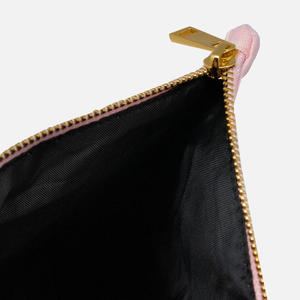 Black water-resistant liner and golden zipper of a powder-pink cotton canvas cosmetic bag: L'Abeille Française