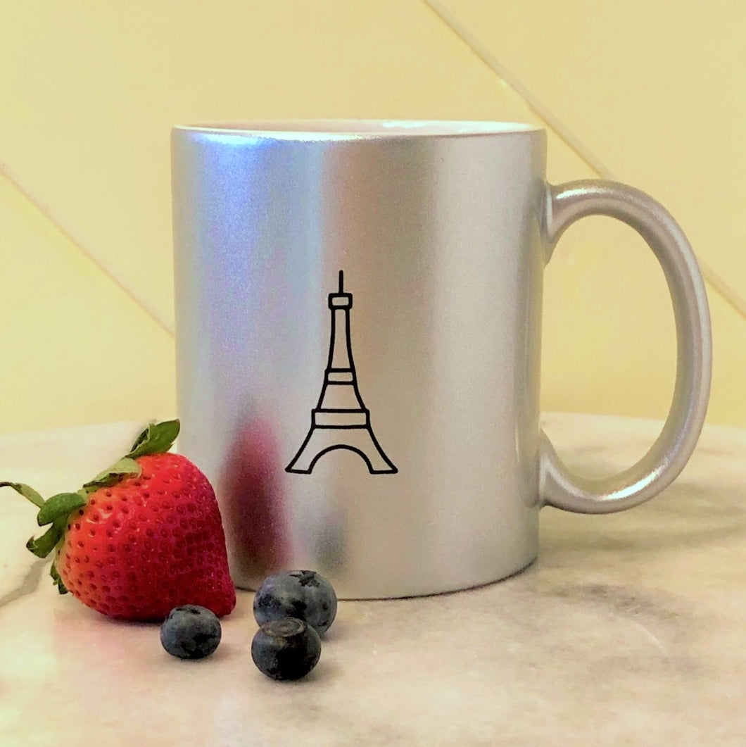 Metallic silver ceramic mug with black graphic of the Eiffel Tower