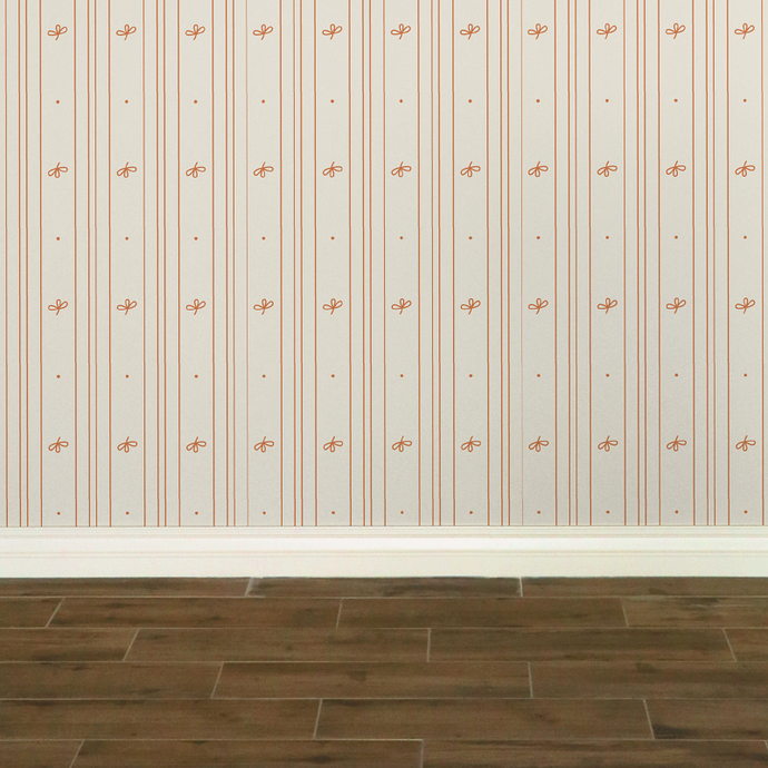 Cream-coloured wallpaper with alternating vertical stripes of peach coloured stylized flower petals and narrow lines: Boutique L'Abeille Française