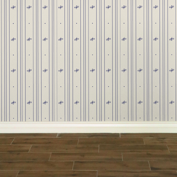 Cream-coloured wallpaper with alternating vertical stripes of lavender blue coloured stylized flower petals and narrow lines: Boutique L'Abeille Française