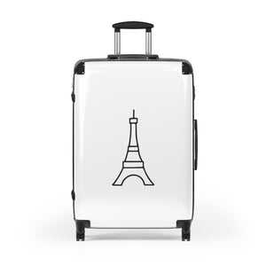 Large hard-shell suitcase with black Eiffel Tower graphic on white background is accented by black trim, back, wheels and telescoping handle: Boutique L'Abeille Française