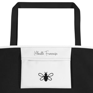 Take Me To Paris Tote white interior pocket with black L'Abeille Française logo and signature bee: Boutique L'Abeille Française